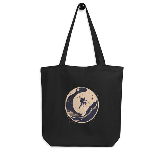 Black tote bag picturing a climber traversing a wall