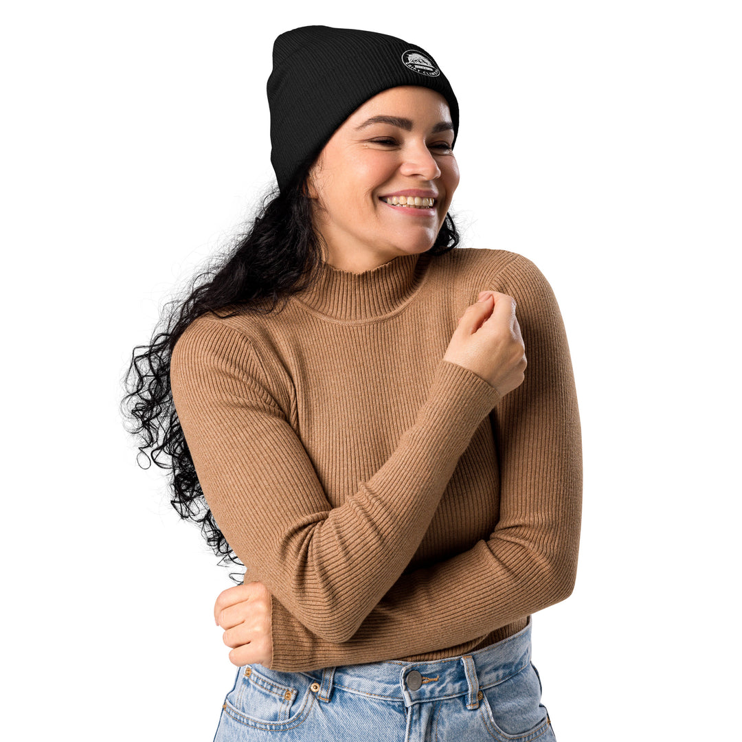Woman in black beanie smiling