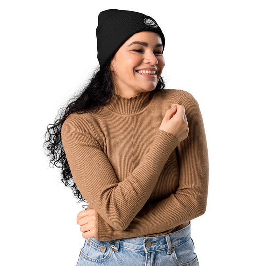Woman in black beanie smiling